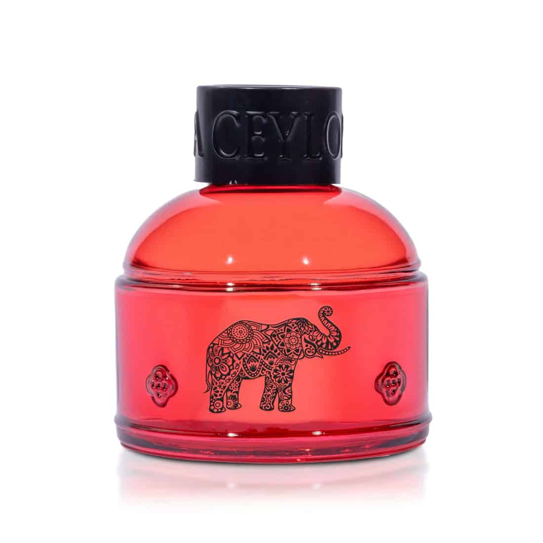 Red luxury perfume bottle with elephant design from Spa Ceylon.