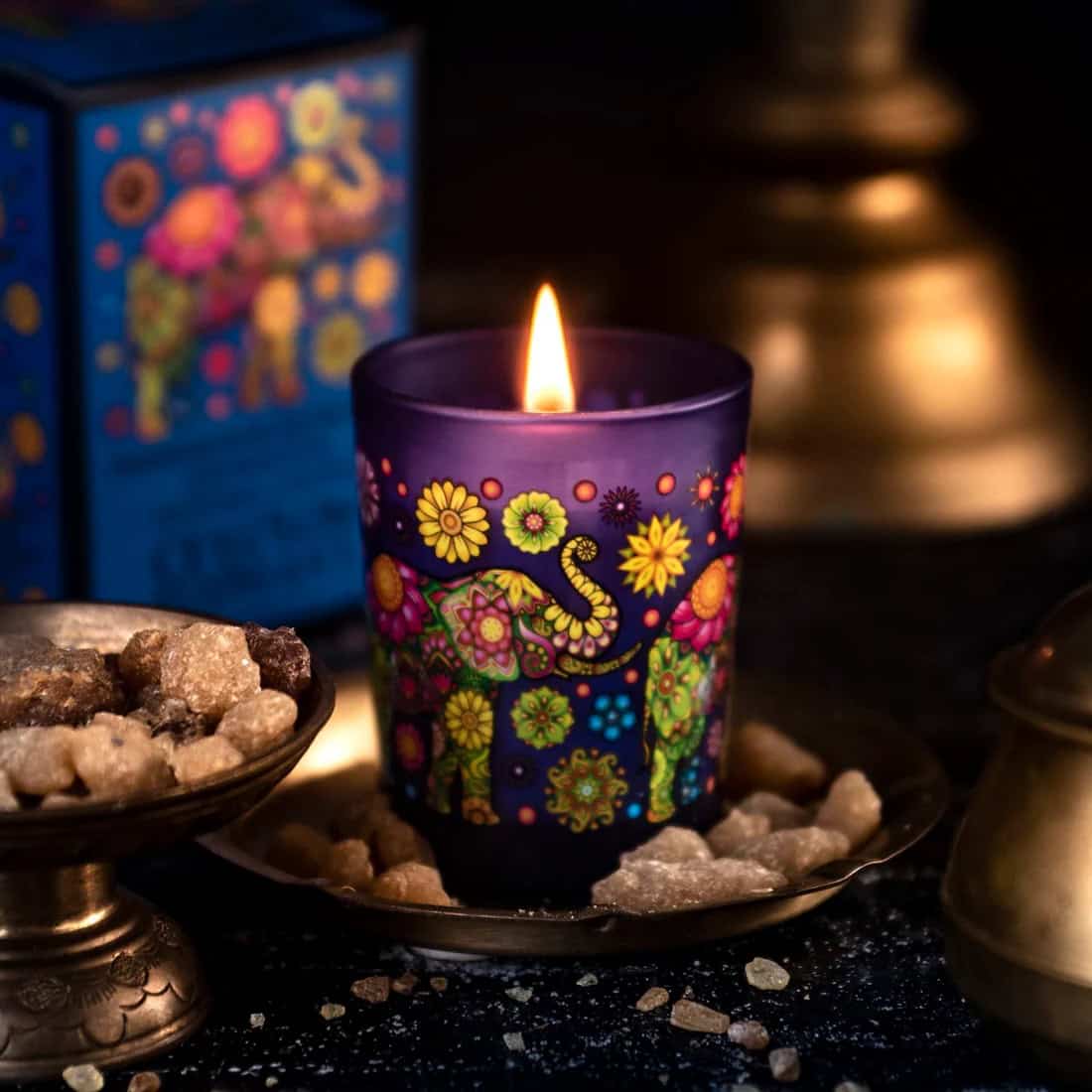Colorful Spa Ceylon candle in a vibrant, floral design, creating a relaxing ambiance.