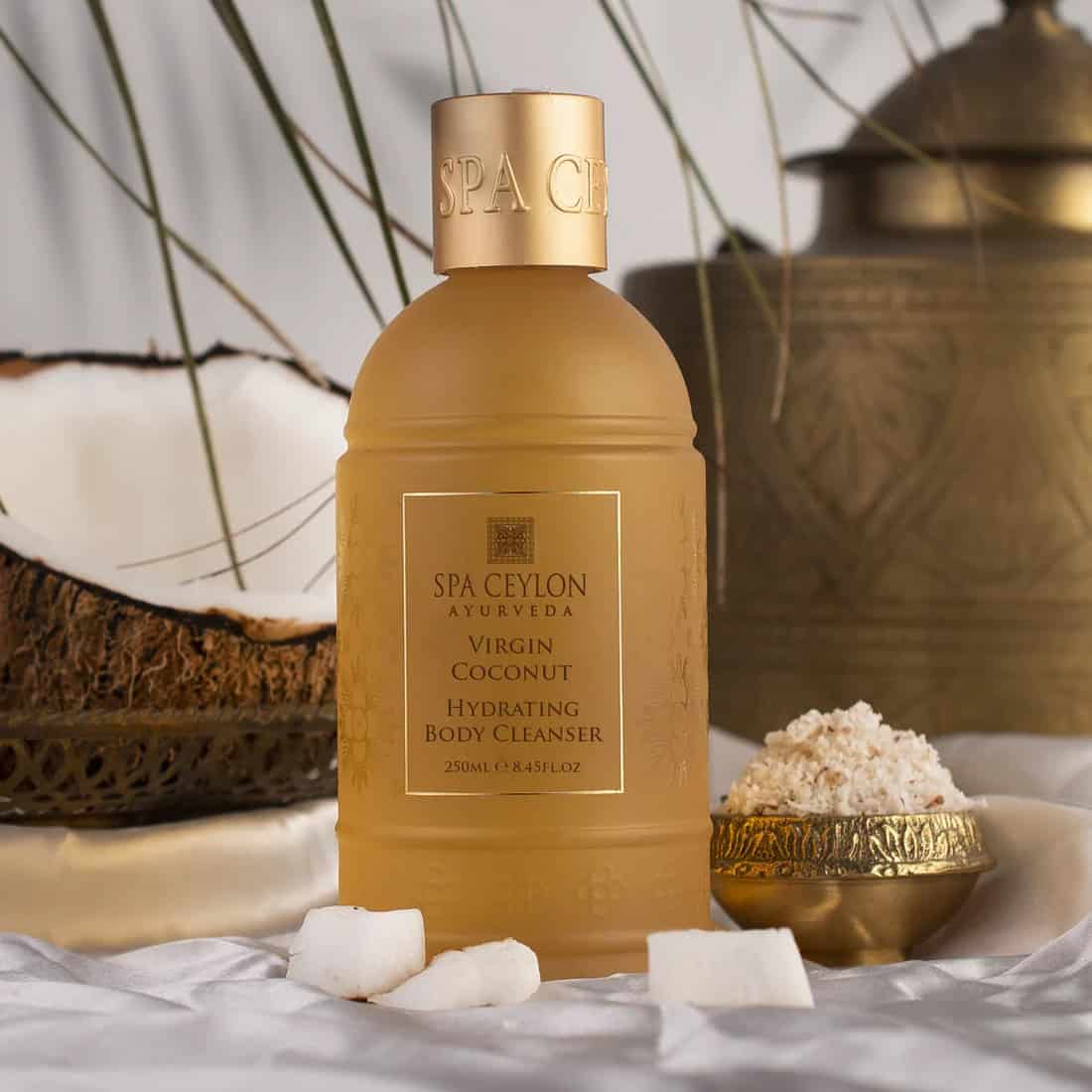 Luxurious Spa Ceylon Virgin Coconut Hydrating Body Cleanser in elegant gold bottle.