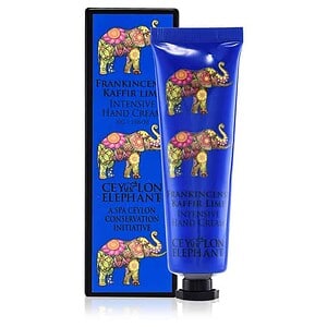 Vibrant blue hand cream with colorful elephant design, Spa Ceylon branding, and elegant packaging for luxury skincare.