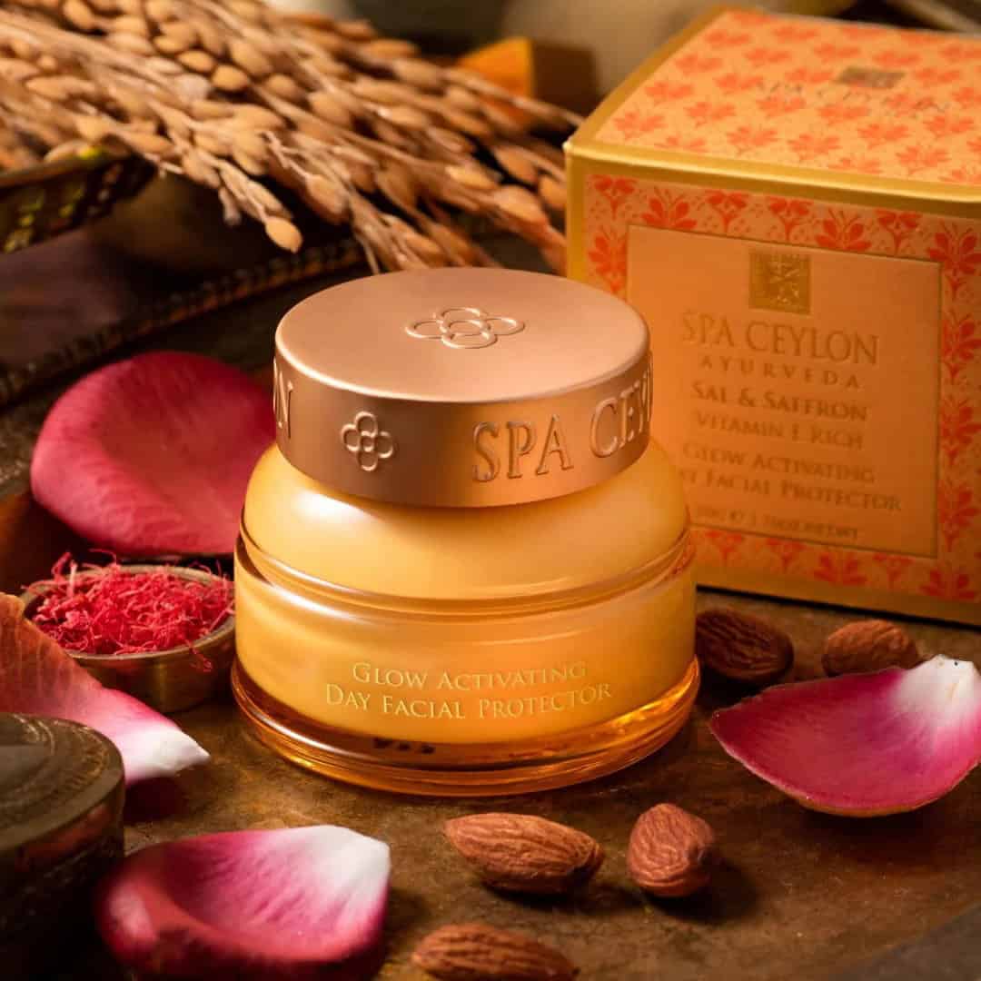 Luxurious Spa Ceylon Glow Activating Day Facial Protector cream in elegant jar with natural ingredients and floral accents.