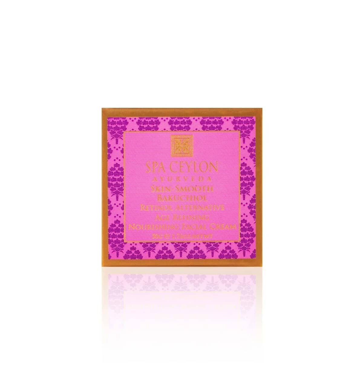Luxurious Spa Ceylon skincare product packaging with vibrant pink and purple floral design.