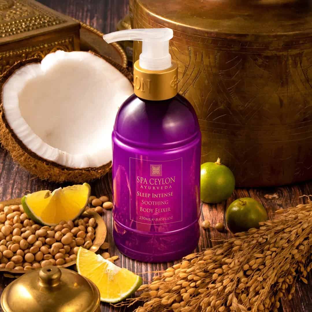 Violet Spa Ceylon Ayurveda Sleep Intense Soothing Body Elixir bottle with coconut, lemon and grain decor, luxury wellness product for relaxation.