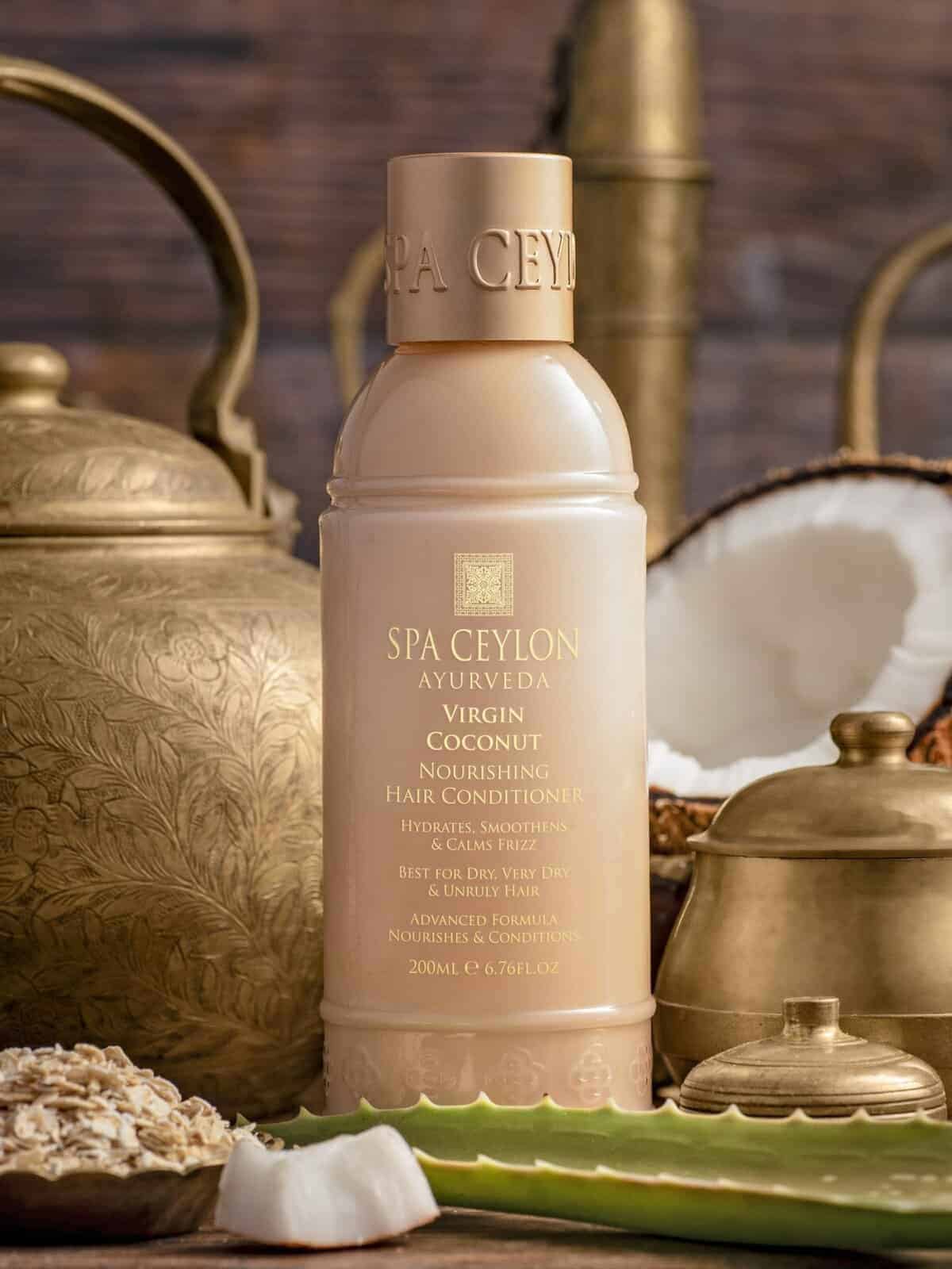 Silk beige Spa Ceylon Ayurveda Virgin Coconut Nourishing Hair Conditioner bottle with traditional brass decor and coconut slices.